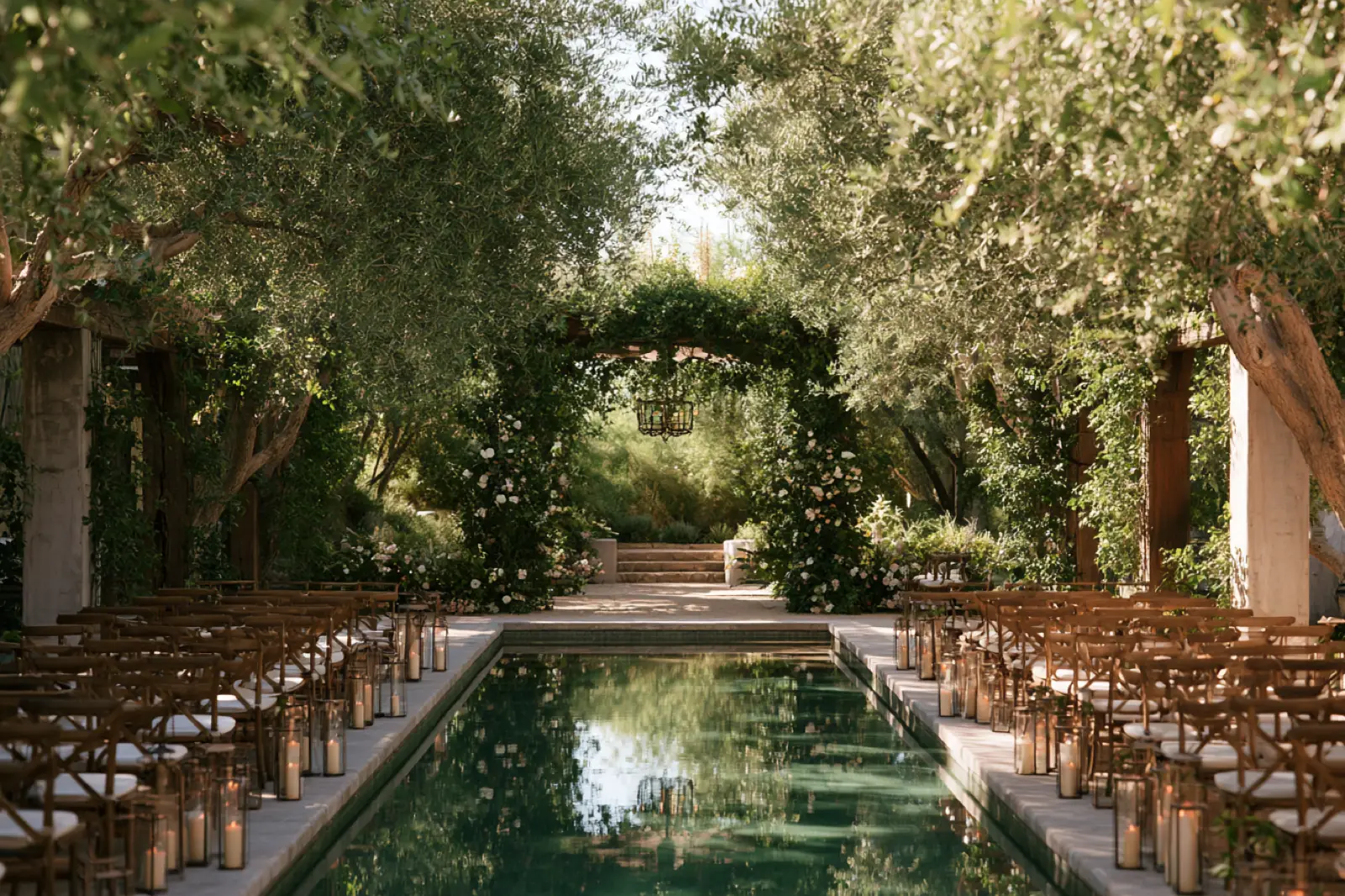 Rows of chairs either side of a long garden pool