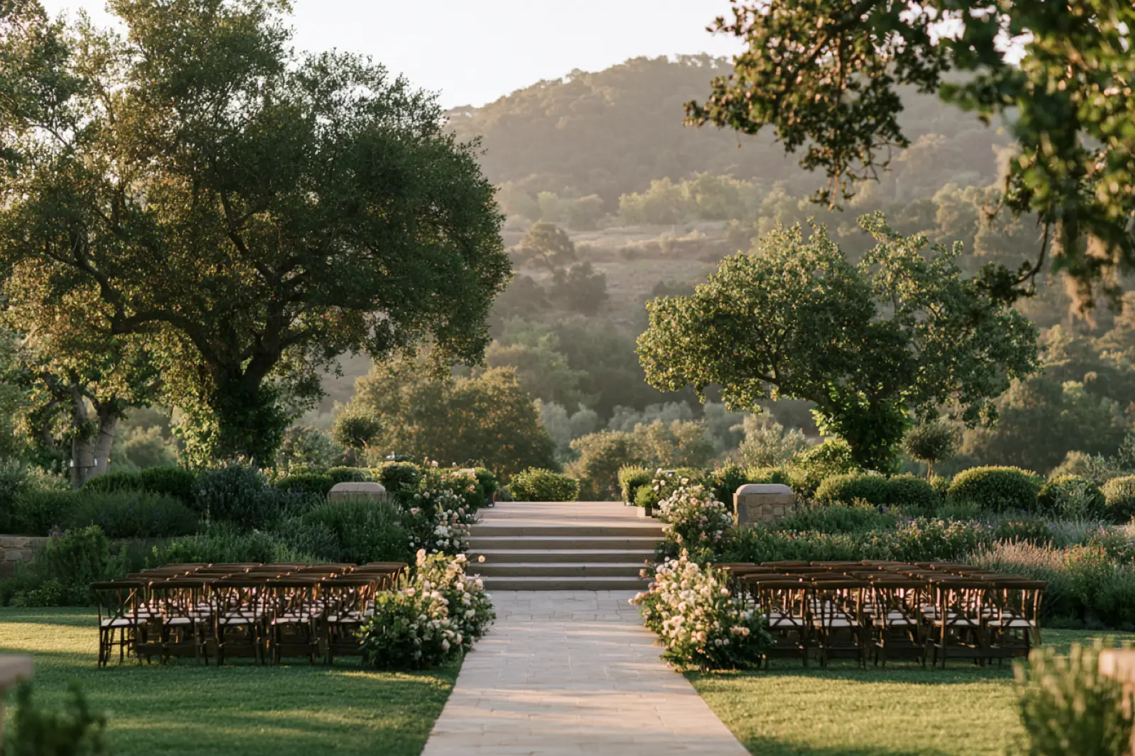 Rows of empty chairs in a garden before the ceremony