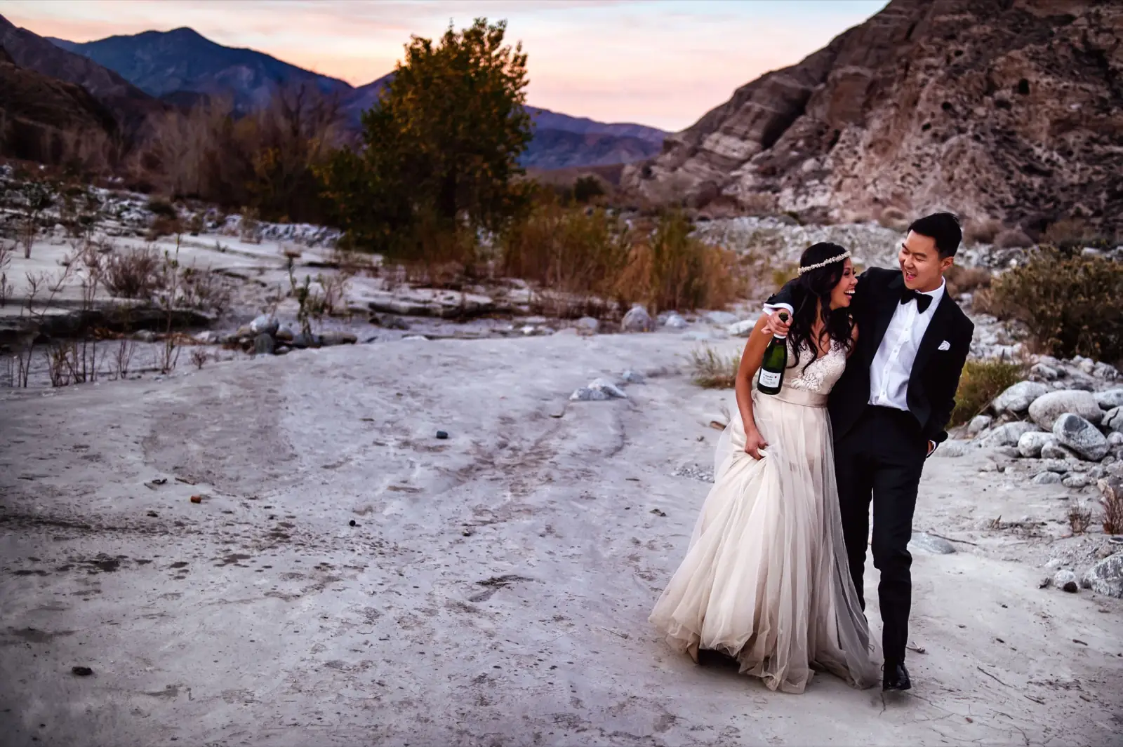 A couple outdoors in a wide landscape