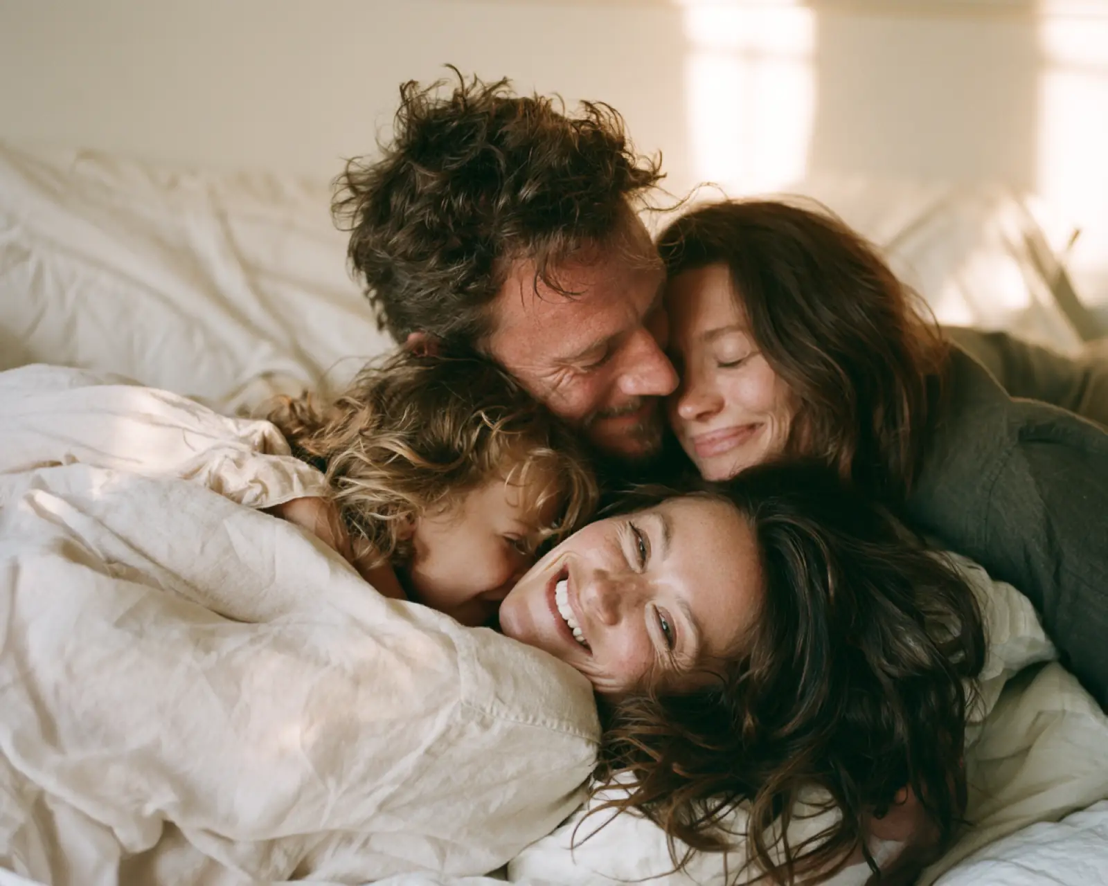 A family gathered closely together at home