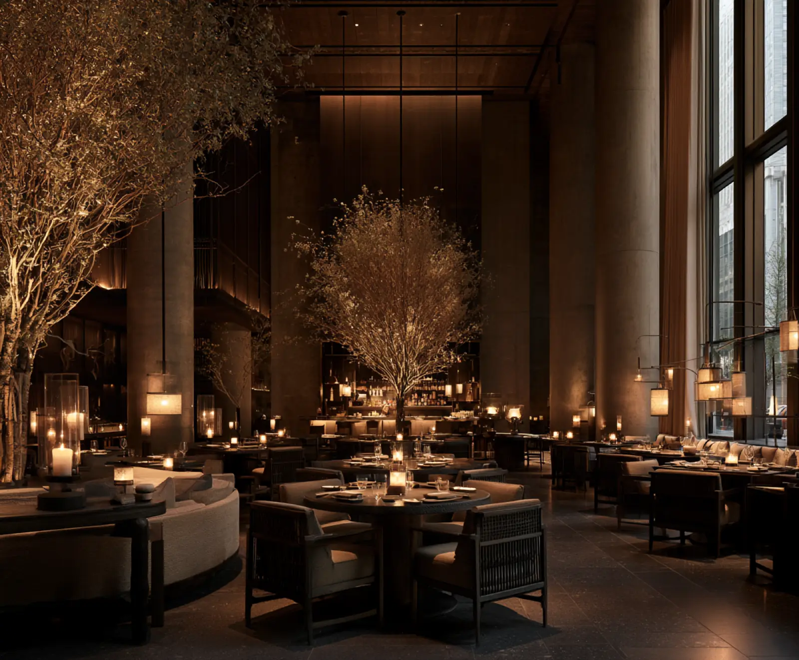 A restaurant under tall windows and olive trees